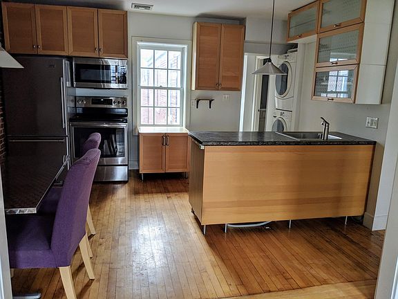 Kitchen, laundry, visible doorway is 2nd bathroom and hallway to bedroom.
