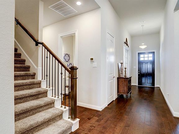 Gorgeous Foyer with Hardwood Floors throughout the Main Living Areas.