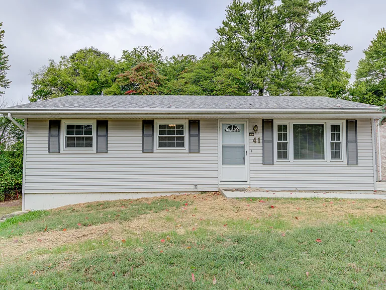 Front of the home. Gravel Driveways on both sides of the home.