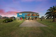 Beautiful sunset view from Verdia. House sits on 4 lots with 2 of those being a fenced in back yard.