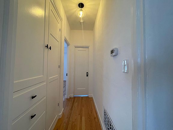 hallway to bathroom and bedroom