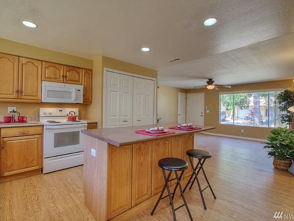 Recessed lighting, breakfast bar, plenty of storage throughout.