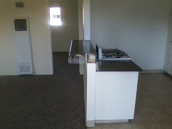 photo from front door showing some of frontroom and kitchen