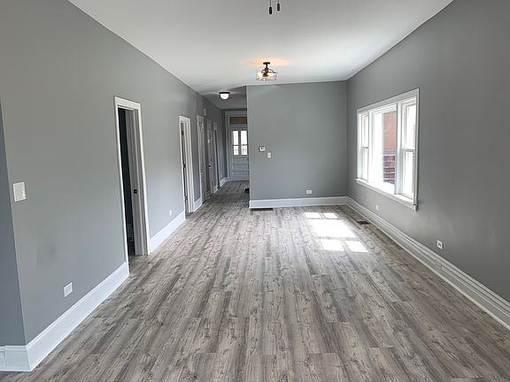 Living Room/Dining room from front of house. (Original Photo)