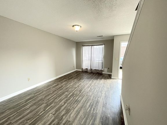 Large living room with wood floors
