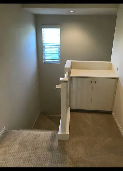 Upstairs landing with storage cabinets