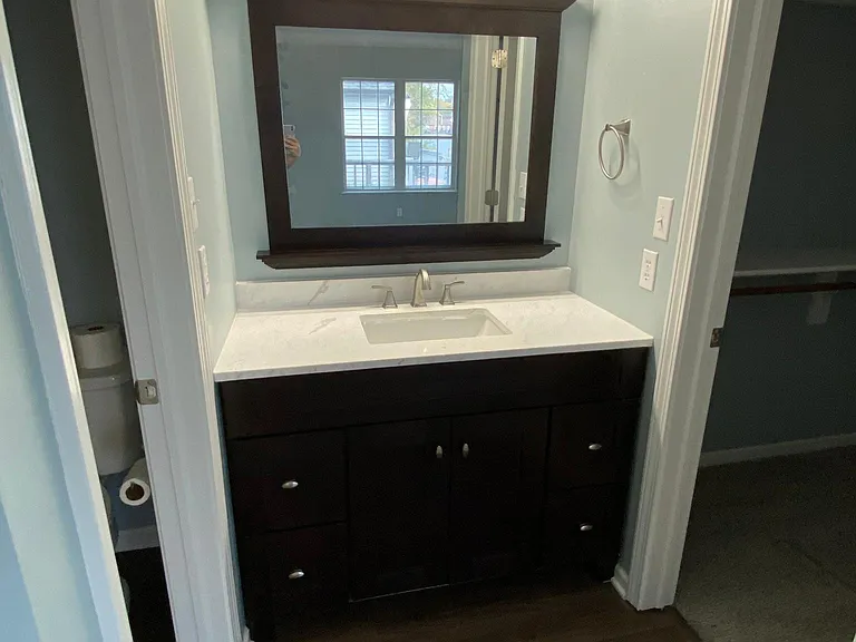 Master Bathroom with Master Bedroom Walk In Closet to the right and remaining parts of the bathroom to the left.