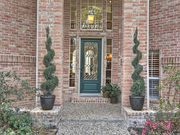 Stately entry accented with leaded glass door.