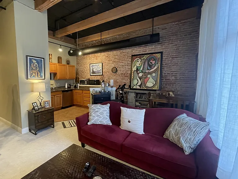 Gorgeous exposed brick, high ceilings and exposed beams throughout.