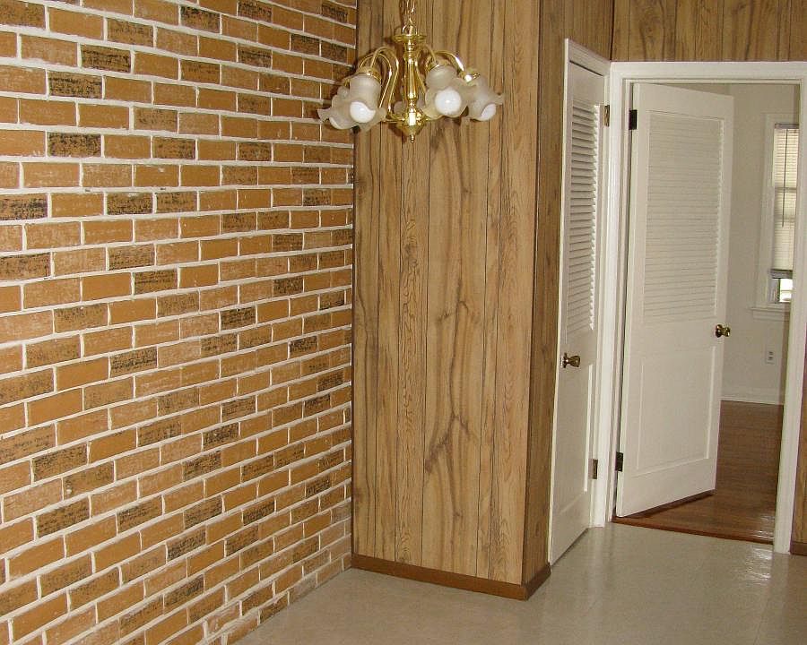 Exposed brick in dining area