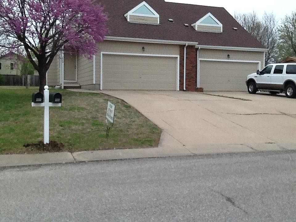 Two car attached garage with opener.