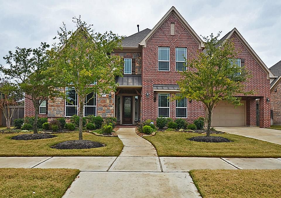 Beautifully upgraded 2 story home with brick and stone elevation.