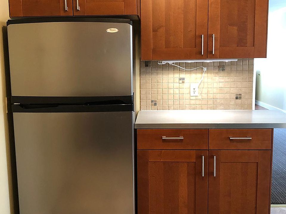 Kitchen, large newer stainless fridge.