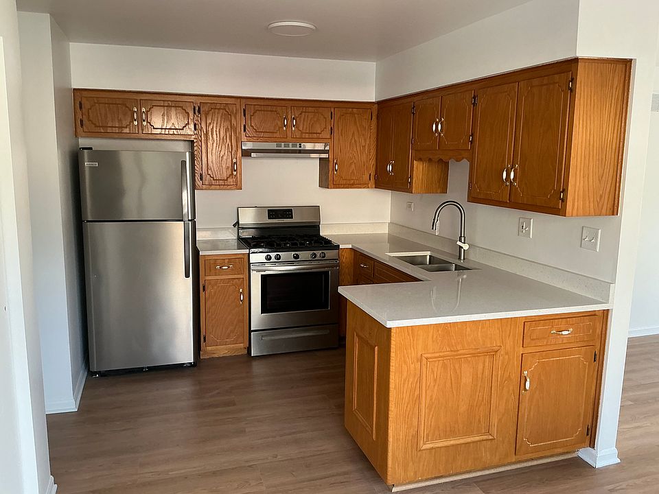 Kitchen with quartz counter top and stainless steel appliances.