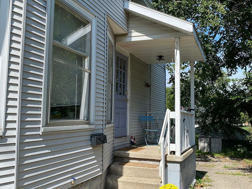 Covered porch is big enough for seating and for bike's parking