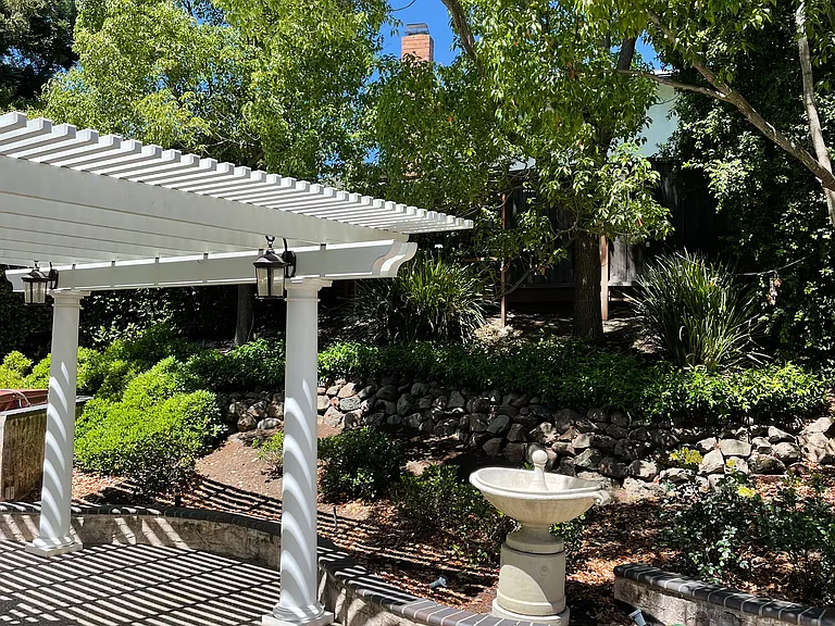 Outdoor concrete patio and water fountain.