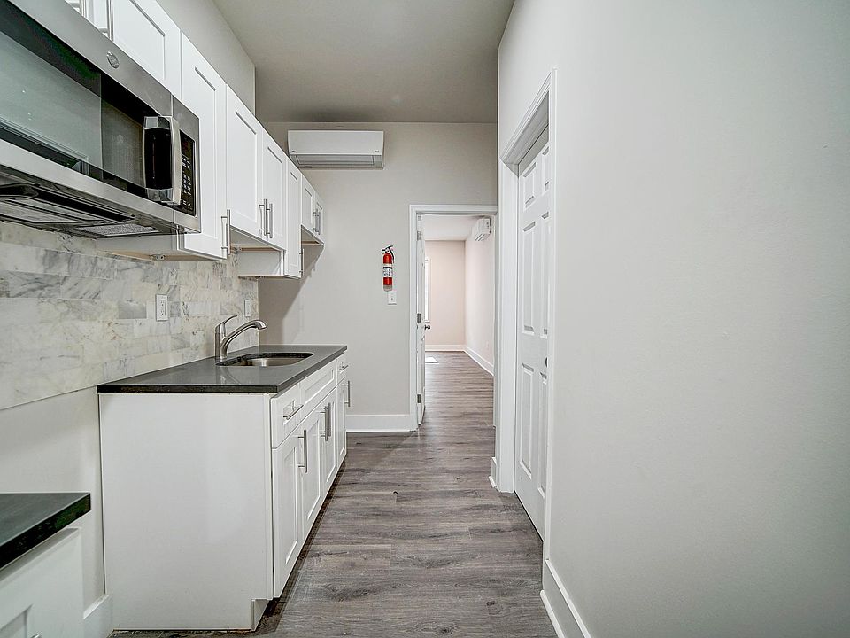 Kitchen includes a stove and fridge
