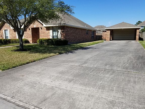 House and detached garage w/ car port, driveway is extra wide