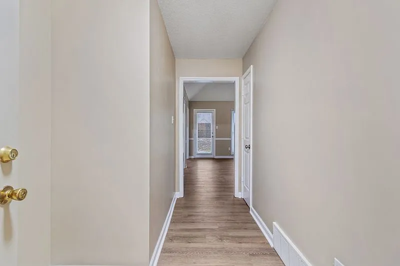 3-Bedroom Brick Home with Fireplace, Primary Suite & Fenced Backyard — Photo 4