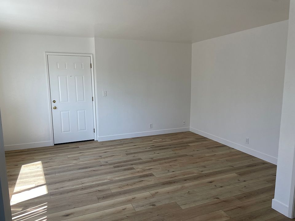 Living room and Front Door and Beautiful flooring throughout, except bathroom, is tile