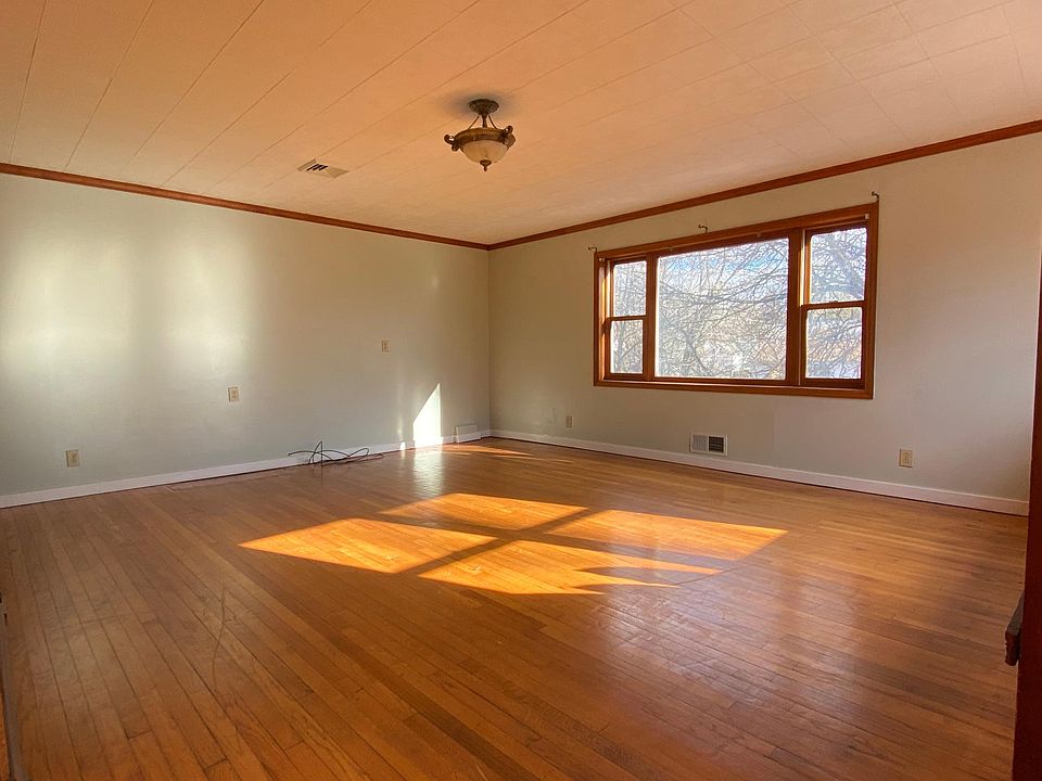 Large sun filled living area with direct access to deck
