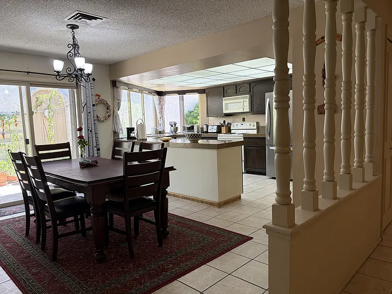 Dining area and kitchen with a view of the side yard