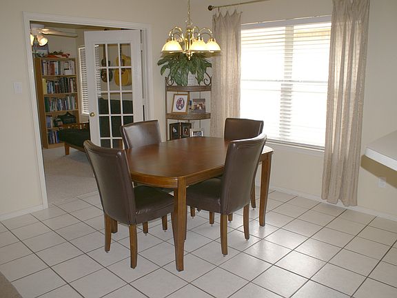 Ceramic Tile in Hall, Dining, Kitchen and Baths