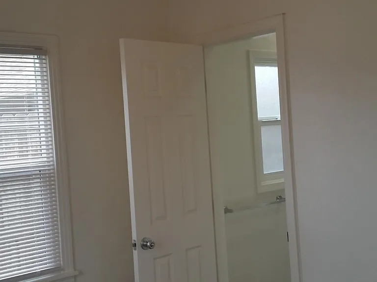 Bedroom leading to bathroom