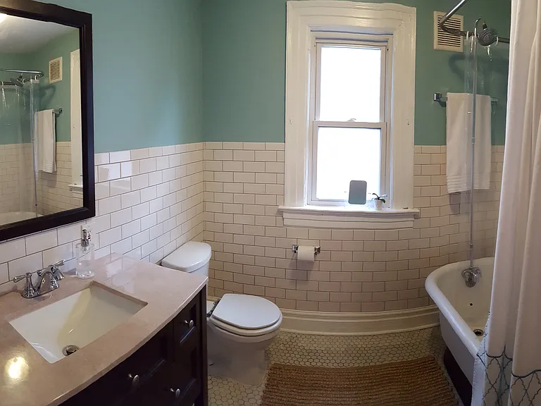 Updated bathroom with original features.