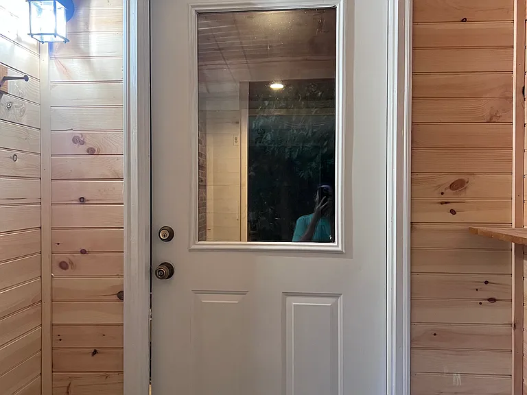 Side entrance new shiplap & coat hooks.