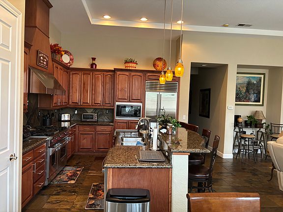 Kitchen with sub zero refrigerator/freezer and Wolfe Range.