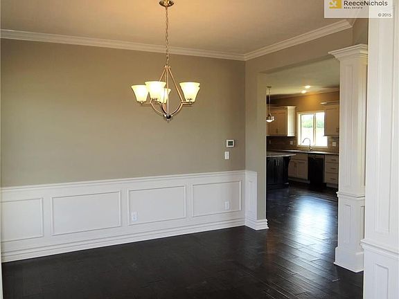 Dining room with gleaming hard wood floors.
