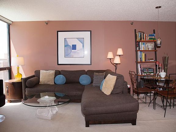 Living room holds sectional sofa, dining table, bookshelf and entertainment cabinet comfortably. Apt. recently painted nice neutral colors throughout.