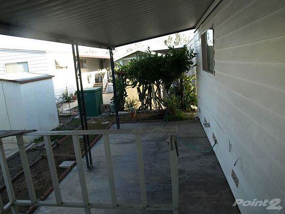 Large patio behind porch