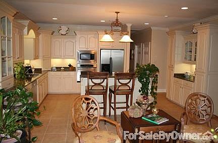 View of the kitchen from the sun room
						:
						Open and airy