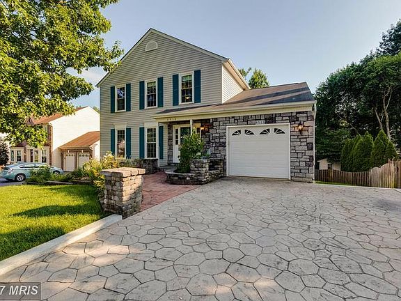 Garage and extensive landscaping welcomes you home