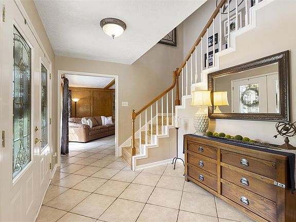 Tall, 2 story ceilings invite you in to the open foyer.