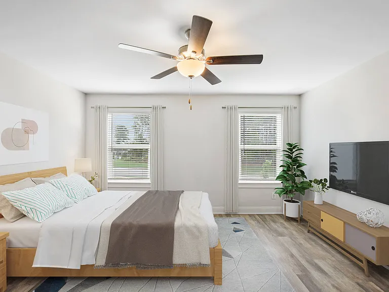 Serene primary suite with a plush king bed, refined finishes, and calming greeneryyour private retreat for rest and relaxation.