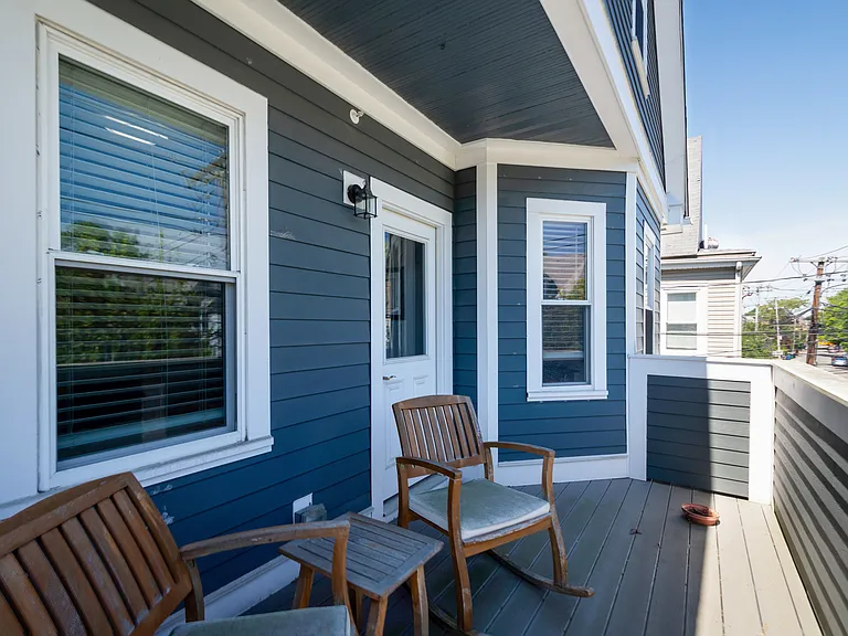 Private front balcony overlooking quiet Morrison Avenue, a low-traffic residential street, with a speed bump in front of this house