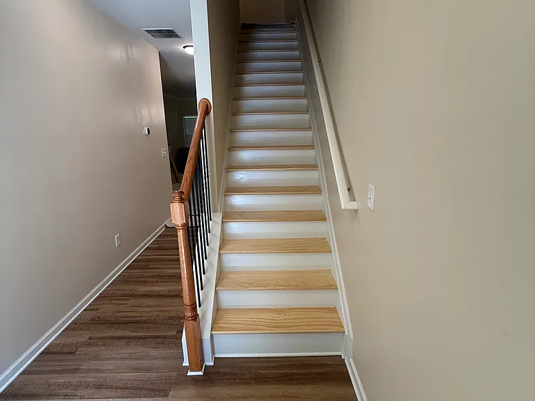 Entryway with newly installed hardwood steps