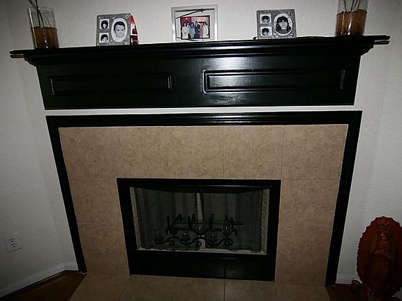 Another view of the fireplace and mantel.