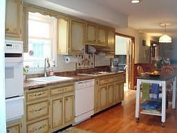 Eat in Kitchen - Custom cabinetry, povincial style, pergo flrs & cooktop (new)