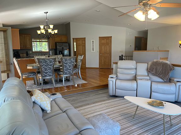 Upper level great room area with kitchen, dining, and living areas.