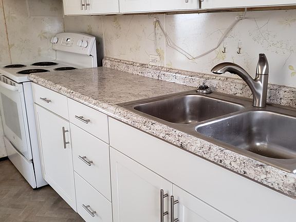 Kitchen - refrigerator is across the room from the sink.