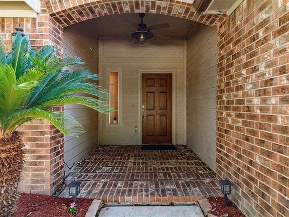 The large covered front porch with a fan is perfect for a cup of coffee- just add comfy bench and potted plants.
