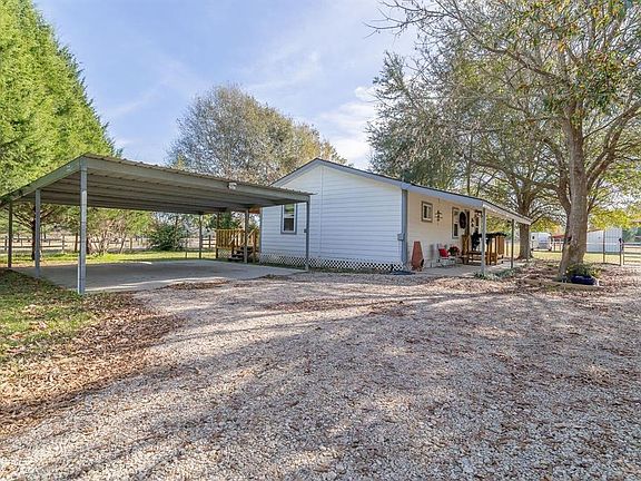Very well maintained home with 2 covered parking spots on a concrete slab.