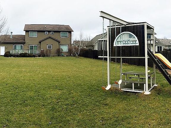 Large backyard with playset