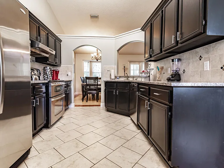 Cabinets and drawers fully stocked with all cookware, utensils, flatware and dishes.