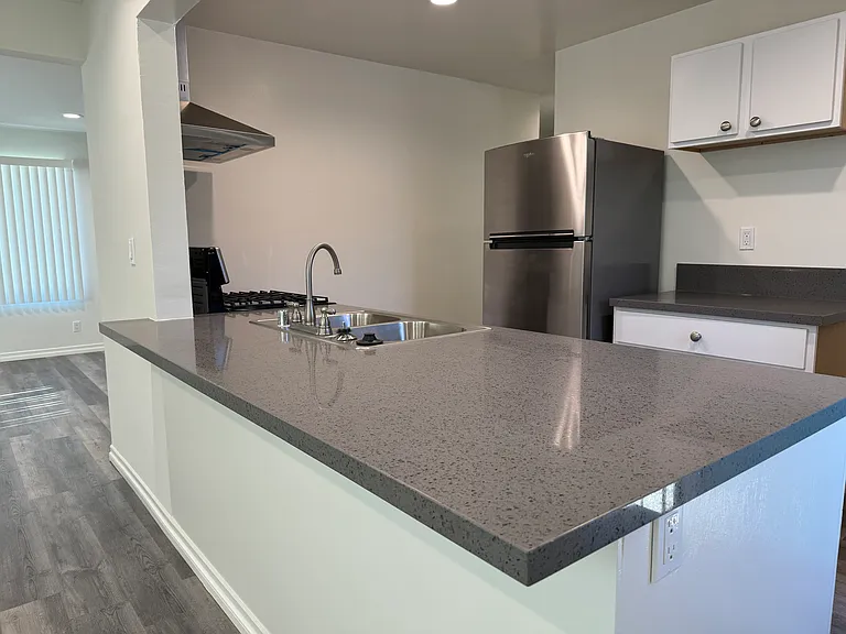 Fabulous counter space for food preparation and entertaining. Add some bar stools to keep the chef company.