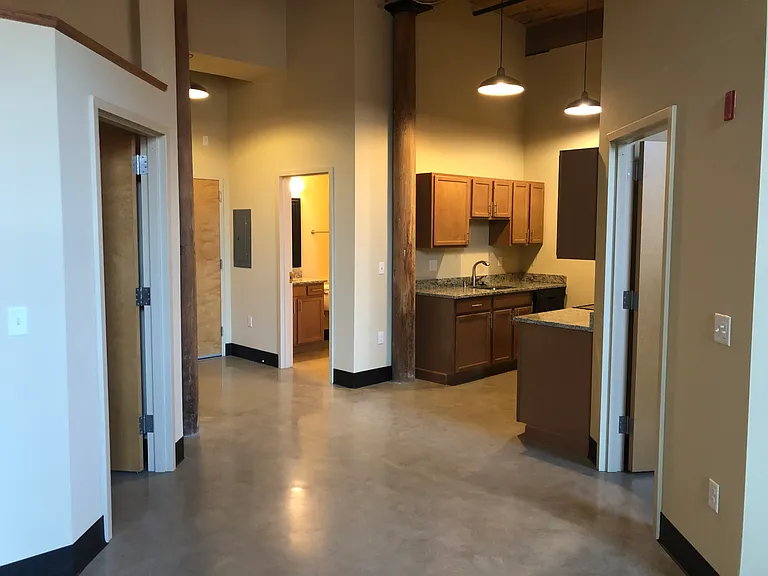 Apt 310 and 410 (2 BR), view into kitchen, bathroom and entrance area, from sitting area.
